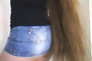 This hot milf in jeans skirt knows how to tease on web camera