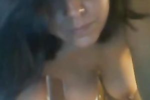Sexy dark-haired ex fuckbuddy shows her scoops and body for the web camera