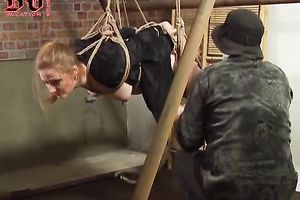 Breasty redhead hotty is nude and bonded with ropes