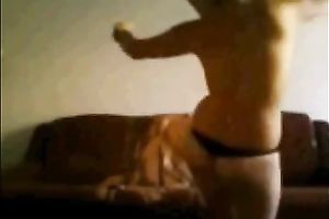 Large bottomed non-professional angel in tongs dancing on a camera