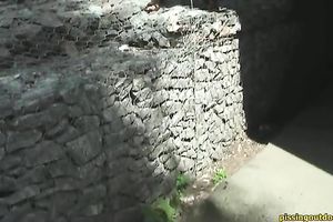 Arousing beauty in costume piddles outdoors and walks away