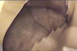 Brunette hottie wearing hose fingers her pussy in homemade solo