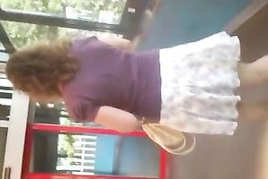 Secretly taking an upskirt movie of bootyful honey on escalator