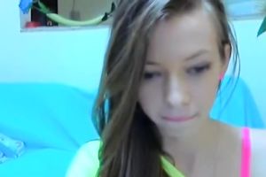 Sexy livecam model rubs her charming pink slit in front of her livecam