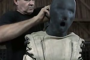 A mask on girl's head and a straitjacket is the beat outfit for a serf amateur wife
