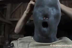 A mask on girl's head and a straitjacket is the beat outfit for a serf amateur wife