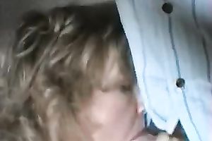 Mature golden-haired shows her cock-sucking skills in homemade movie scene