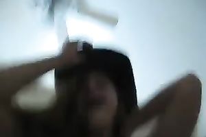 She even wears a cowboy hat to look like a lascivious cowgirl