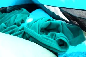 This nasty gal is having the fucking of a lifetime in a tent
