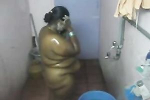 Fat Indian BBC slut washes her body in the baths in hidden webcam clip