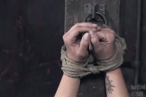 Tattooed hussy acquires suspended in BDSM movie scene and enjoys toying