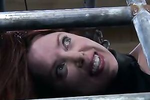 Dissolute redhead chick with great shapes masturbates in the cage