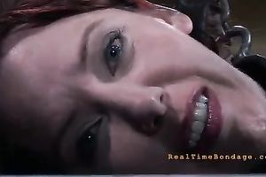 Dissolute redhead chick with great shapes masturbates in the cage