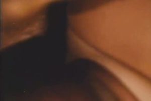 Brown-haired babe allows a stud to face-fuck her in retro sex movie