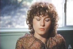 Brown-haired babe allows a stud to face-fuck her in retro sex movie