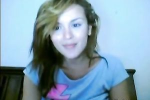 Amateur honey pleases herself with fingering in front of a webcam