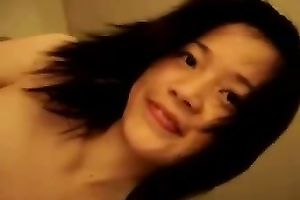 Hot Chinese legal age teenager is on top of me playing with my pecker