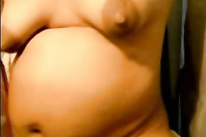 My breasty preggy slutty wife fingers her shaved bawdy cleft indoors