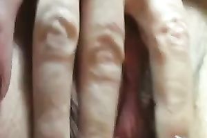 Fake-boobed blonde milf plays with her cookie in close up scene