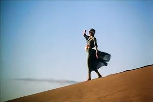 Hungry chap is going to eat curly slit of his titless fair haired babe in desert