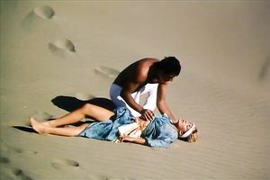 Hungry chap is going to eat curly slit of his titless fair haired babe in desert