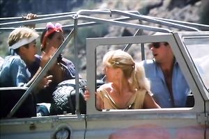 Hungry chap is going to eat curly slit of his titless fair haired babe in desert
