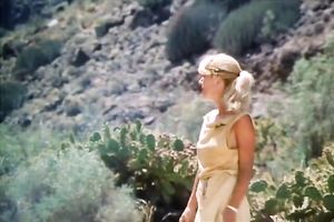 Hungry chap is going to eat curly slit of his titless fair haired babe in desert