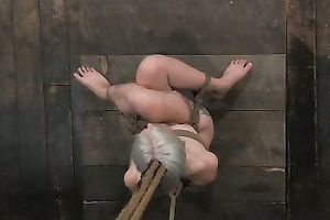 Small titted blondie fastened with ropes is tortured in barn