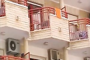 Hot small golden-haired neighbour on the balcony filmed upskirt