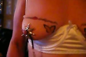 Mature floozy shows her tattooed boobs to me and gives me a tugjob