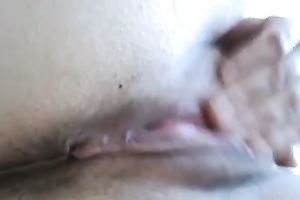My kinky GF entertains herself by fingering her hairless coochie