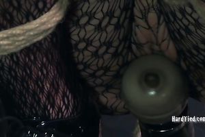 Perverted servitude dominant stimulates his slave's snatch with vibrator