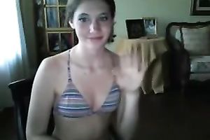 Lengthy web camera honey takes off bikini and masturbates cunt