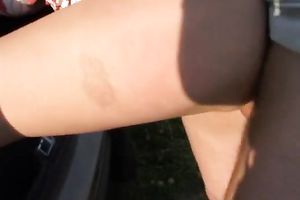 Cute and playful girlfriend bows over for her guy outdoors