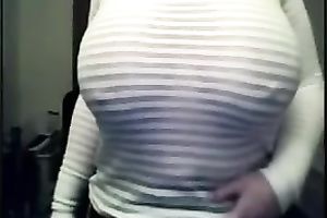 Webcam solo with a juggy brunette hair milf showing her milk cans