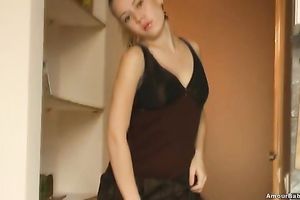 Blonde honey Carol demonstrates her skinny body in the kitchen