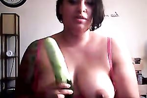 Thick and breasty brunette hair strumpet on cam plays with a cucumber