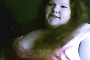 Redhead fattie plays with her bra buddies and slit in cam solo scene