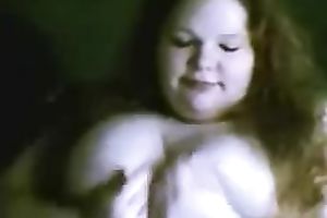 Redhead fattie plays with her bra buddies and slit in cam solo scene