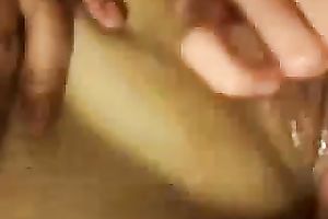 Beating off the beaver during the time that that babe stimulates her love button with miniature vibrator