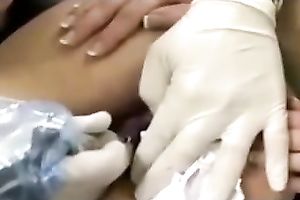 Check out how a lustful wench acquires her arse aperture tattooed