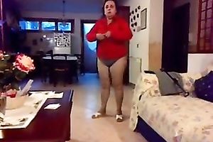 Chubby aged black cock slut changes her clothing in front of a camera