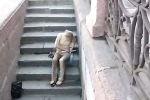 Lena pees her panties and changes her raiment on the stairway