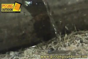 Cute teenage girl with pigtails makes water in the forest