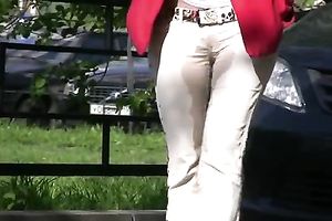 Tanya soaks her trousers in the street and changes her clothing