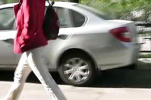 Tanya soaks her trousers in the street and changes her clothing