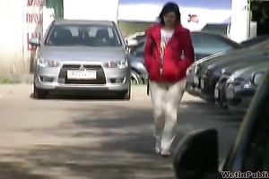 Tanya soaks her trousers in the street and changes her clothing