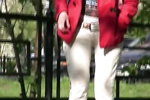 Tanya soaks her trousers in the street and changes her clothing