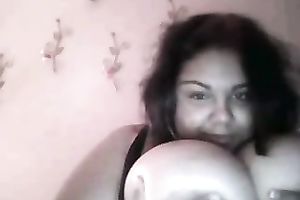 Cute black skin dark brown playgirl shows off her heavy boobies