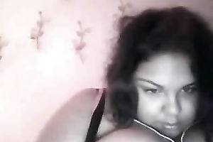 Cute black skin dark brown playgirl shows off her heavy boobies